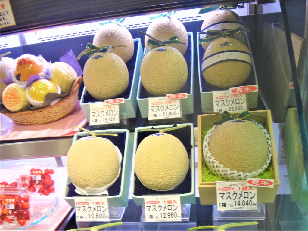 Selection of melon fruit in a Japanese shop. They are all in individual boxes with individual prices - these range from 10,800 yen to 25.920 yen