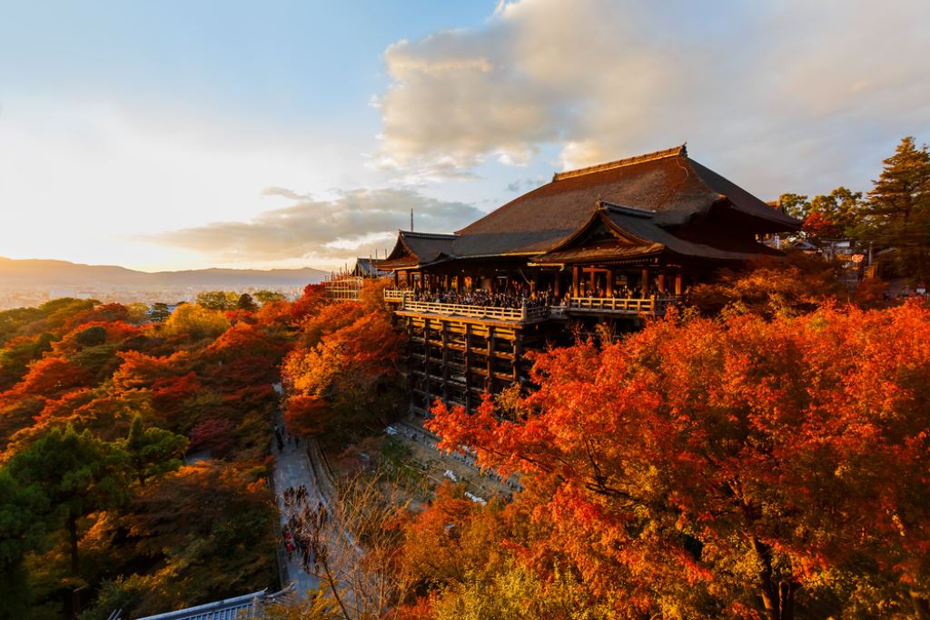 The hilltop Kiyomizudera temple in Kyoto surrounded by red leaves