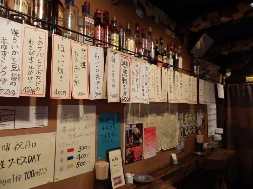 Menu at a small Japanese izakaya showing the menu ingredients in Japanese writing.