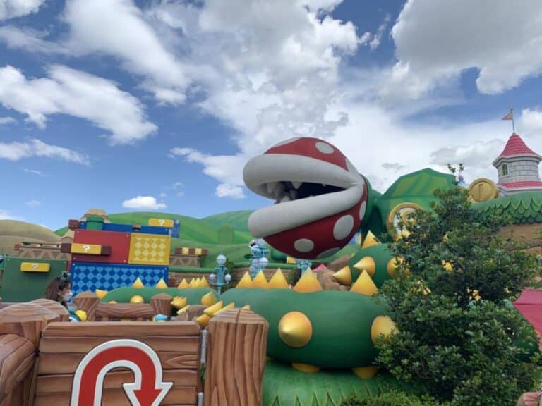 Super Nintendo World, USJ. View of giant flower with a mouth on top of the yoshi's adventure ride.