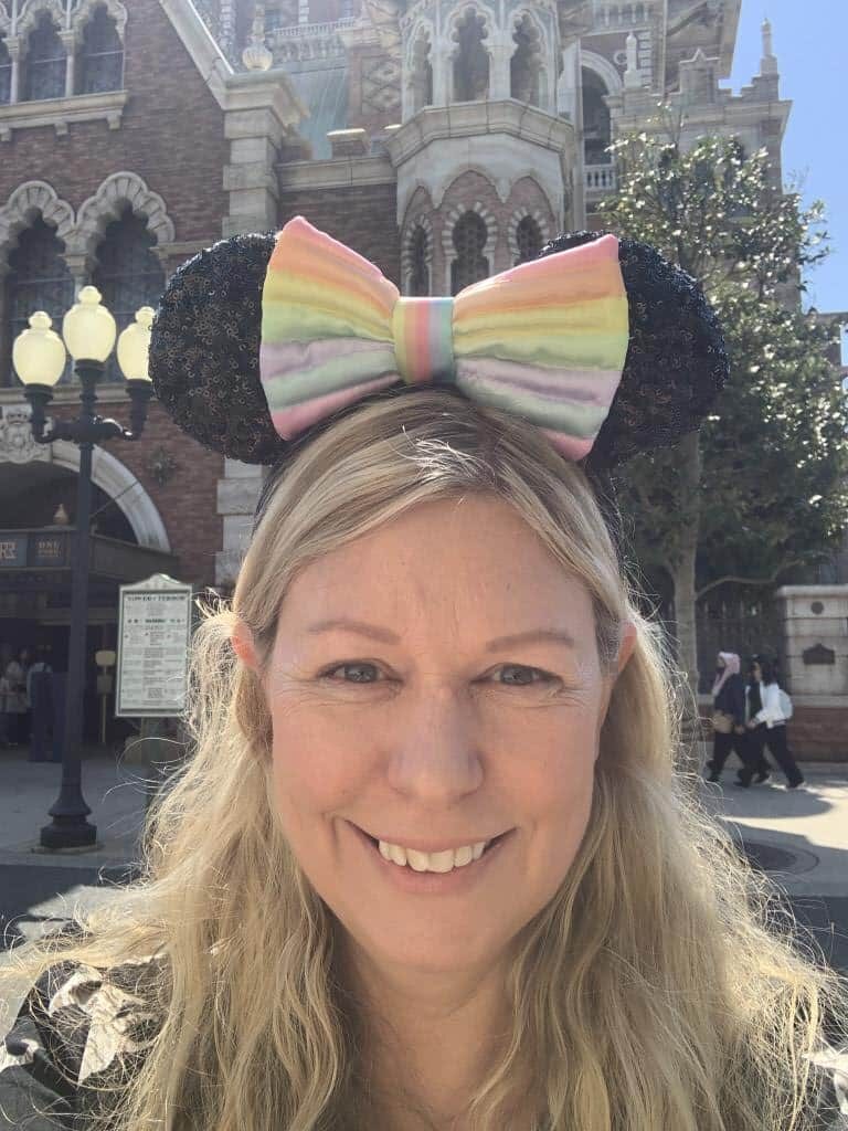 Helen from Japlanease wearing Mickey Ears in front of the Tower of Terror in Tokyo DisneySea - this is one of the premier access rides at the park. 