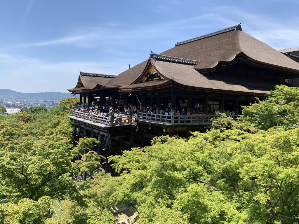 Another view of the Kiyo mizu dera in Kyoto. In this picture, the trees are green and you can see crowds of people on the balcony of the temple that overlooks Kyoto.