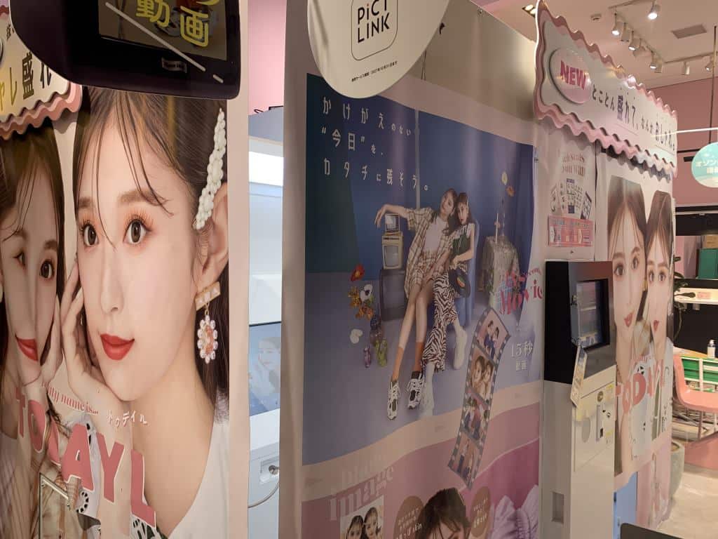 Purikura machines in Harakuju. The outside is covered in photos of pretty girls with features altered slightly by the machines.