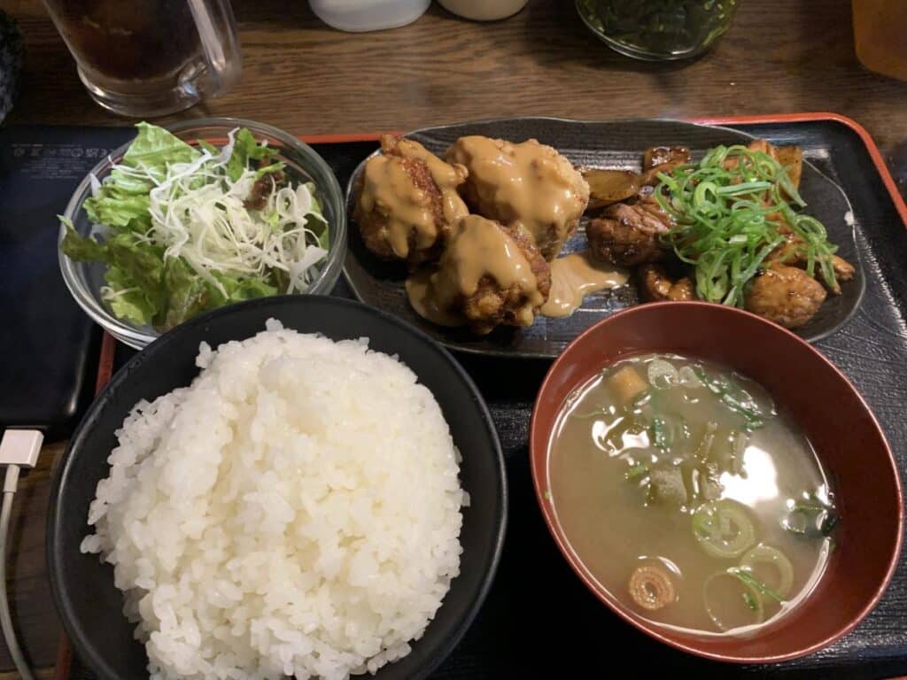 Set meal of miso soup, rice, a small salad and pieces of fried chicken from a restaurant in Osaka
