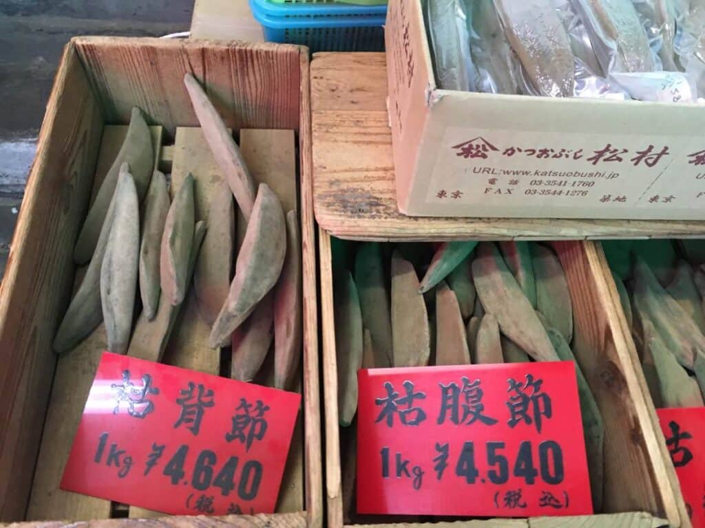 Display of dried bonito in Tsukiji Market. When cut and dried this fish forms incredibly hard blocks which look almost like wood. These are shaved into bonito flakes used in Japanese cooking.