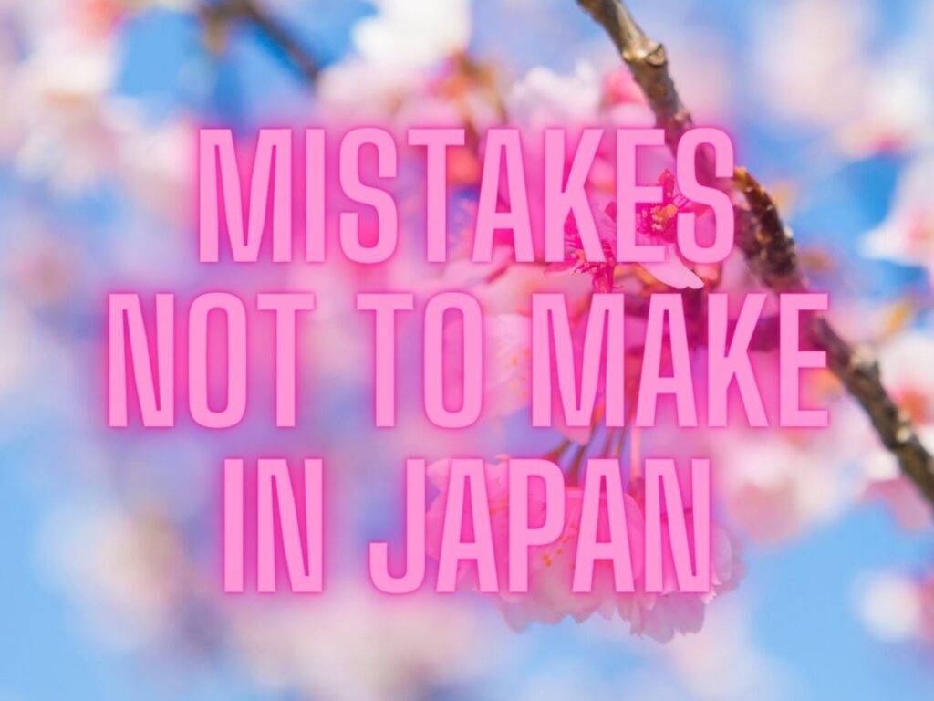 Graphic image of cherry blossoms with pink writing over the top reading 'mistakes not to make in Japan'
