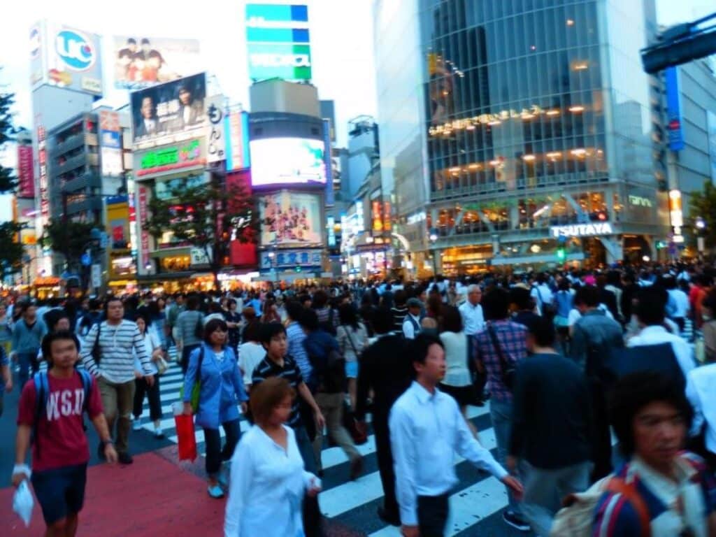 Hundreds of people crossing the Shibuya Crossing in Tokyo