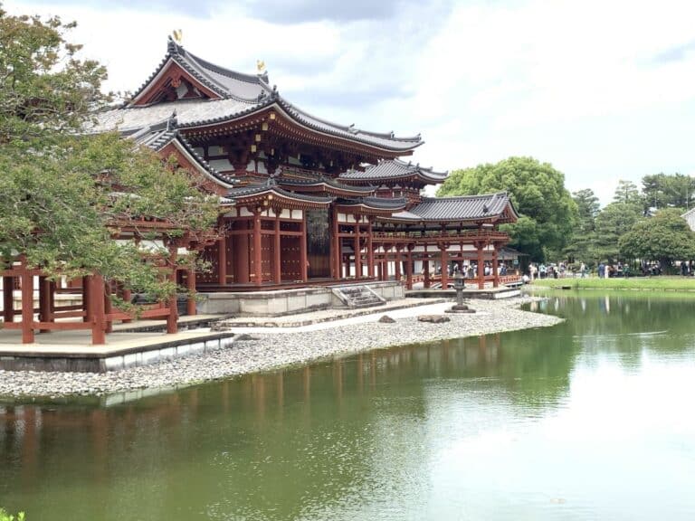 Side view of the red pagoda style exterior of Byo-doin in Uji