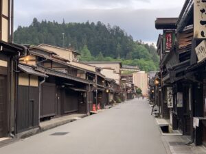 View looking down one of the old streets of Takayama. It is lined with old wooden houses.