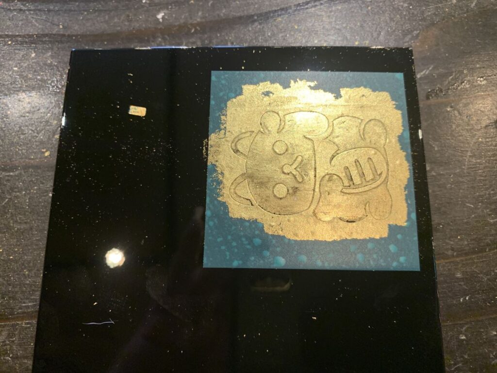 Gold leaf applied over the top of the stencil in Kanazawa