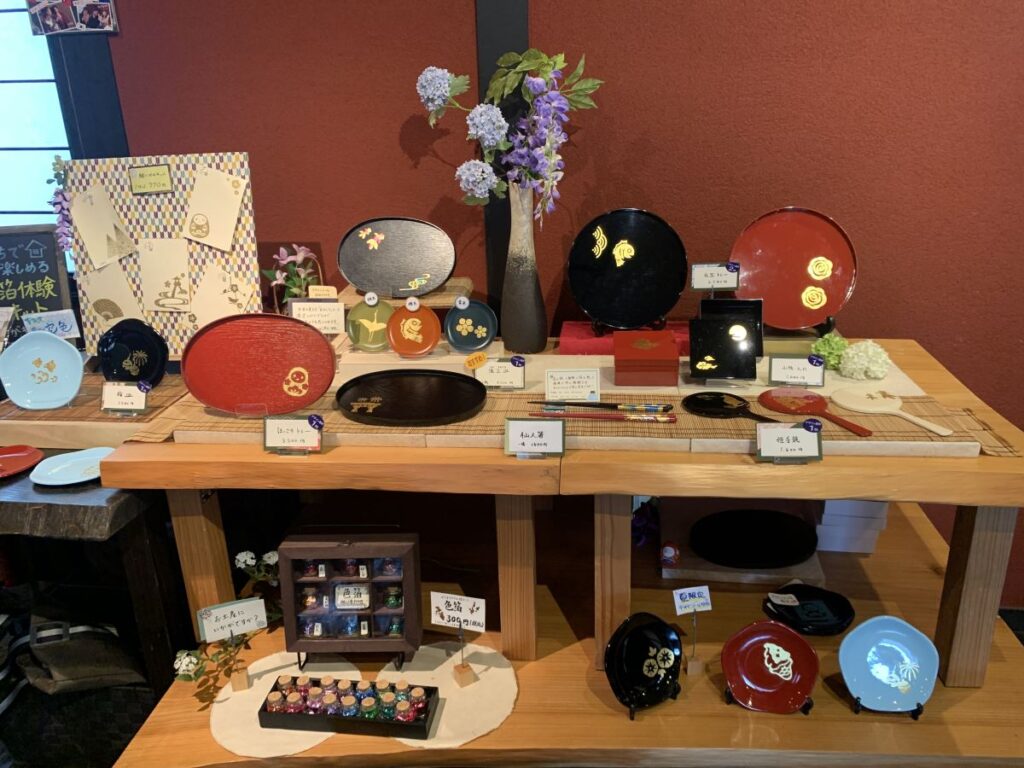 Display of all the different things you can cover with gold leaf at the gold leaf experience in Kanazawa