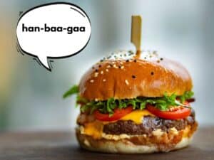 Image of a hamgburger. A speech bubble next to it has the Japanese pronunciation 'han-baa-gaa' next to it.