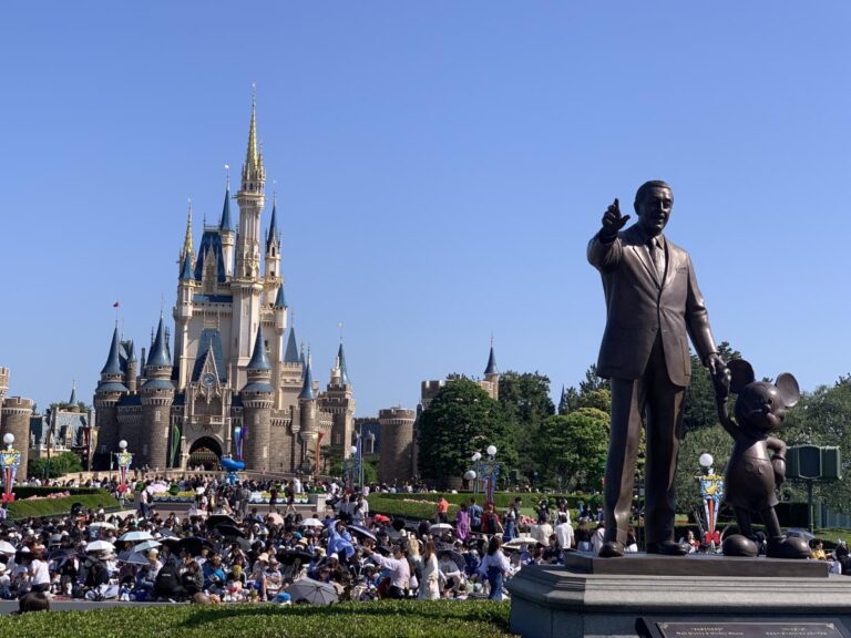 Tokyo Disney castle and Walt Disney statue