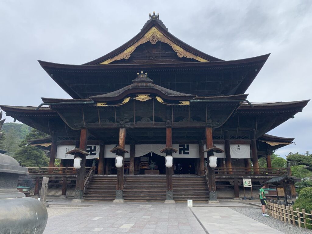 Zenkoji temple main hall in the early morning. Only one other person is in sight