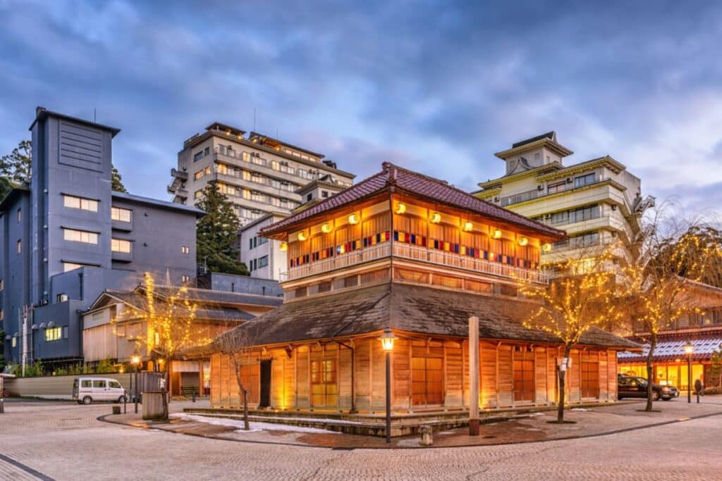 View of the traditional onsen building in Kaga onsen at dusk