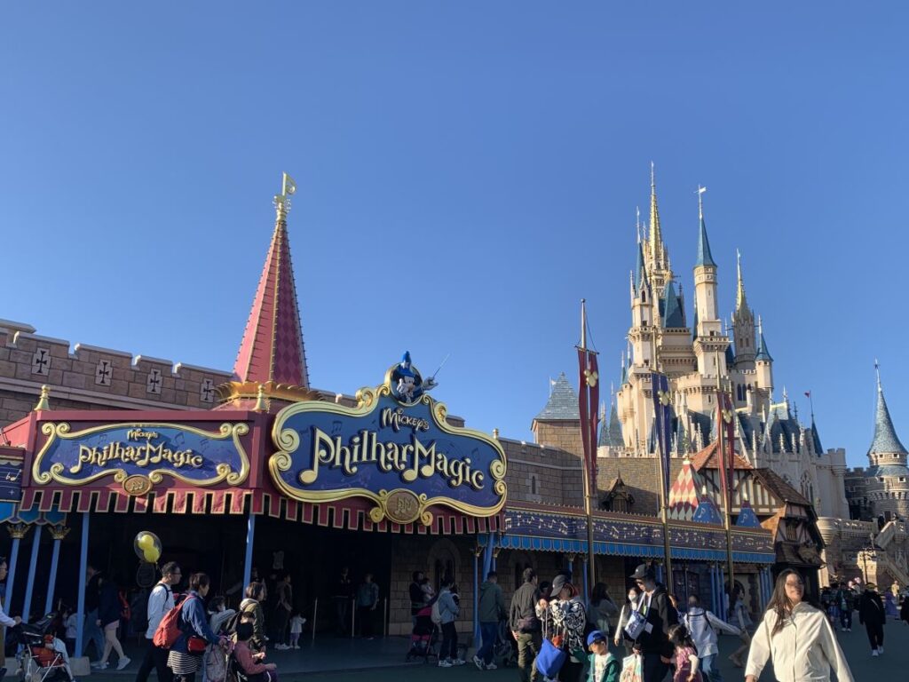 Exterior of Mickey's Philharmagic with the castle in the background