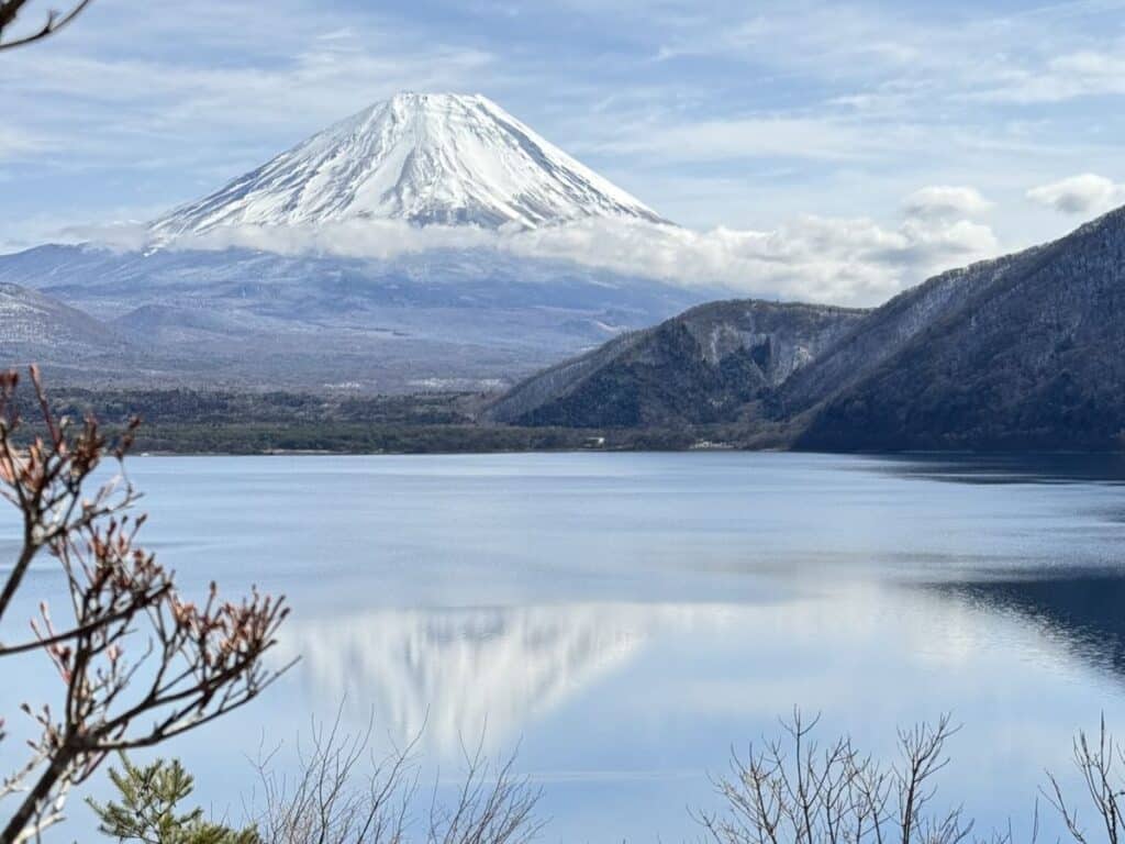 Snow topped Mount Fuji reflected in the lake. 