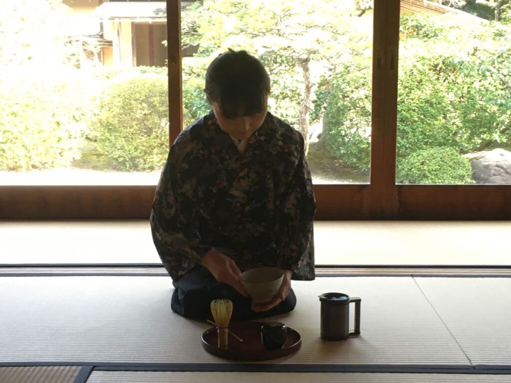 Woman leads tea ceremony in Matsue, Japan