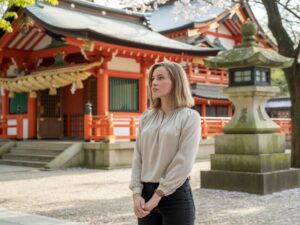 woman standing at a shrine in japan