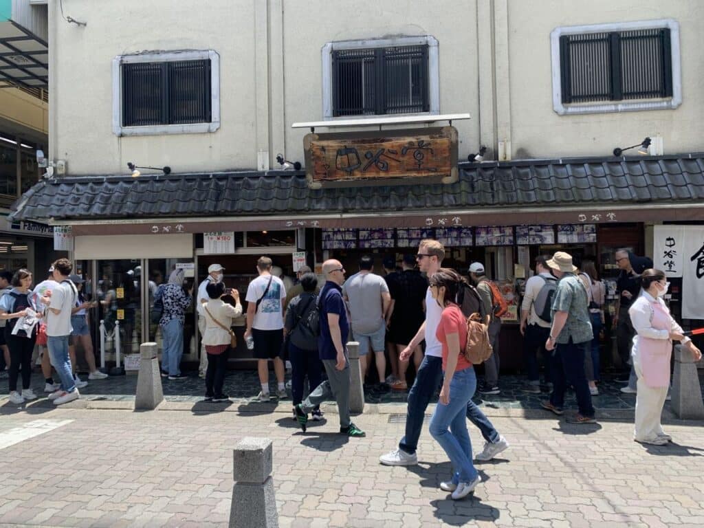 Queue of people outside teh famous Nara mochi pounding shop
