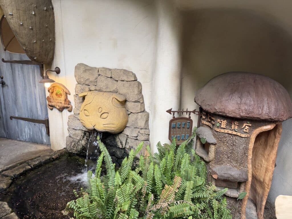 Cat shaped fountain outside the Cat Cafe at Petit Mura
