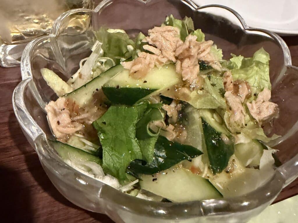 Salad of cucumber and lettuce topped with tuna and dressing served as an otoshi in Fujiyoshida