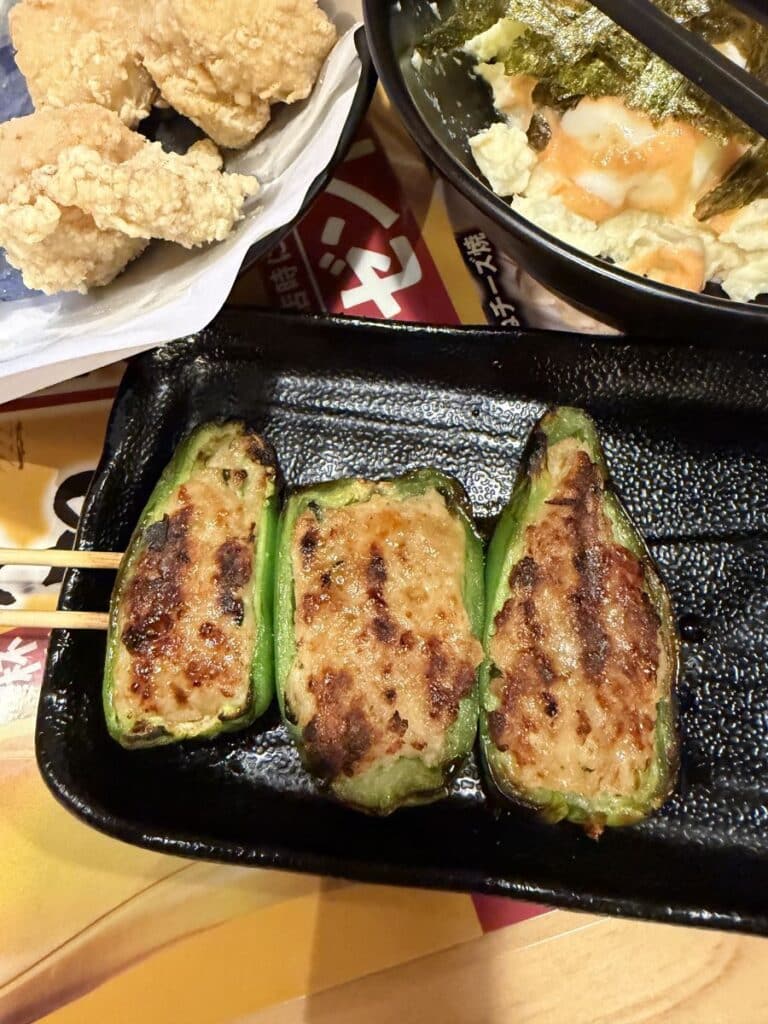 gilled peppers stuffed with chicken and cheese at an izakaya chain in Tokyo