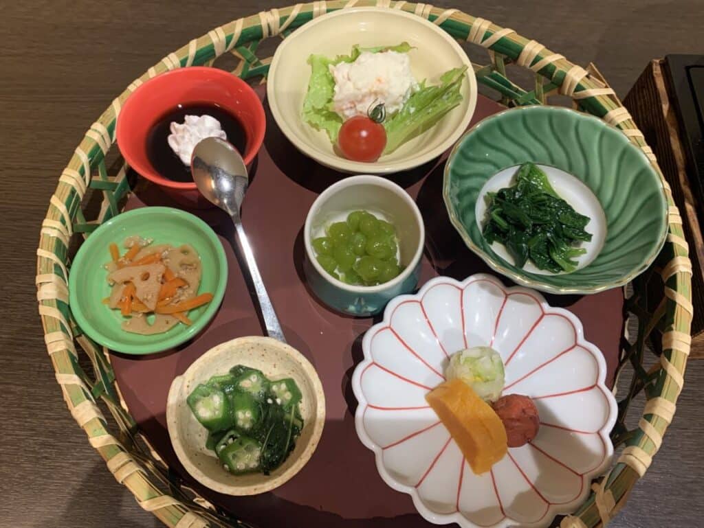 Five small dishes of vegetables (and two sweet dishes) make up part of a kaiseki meal in Japan