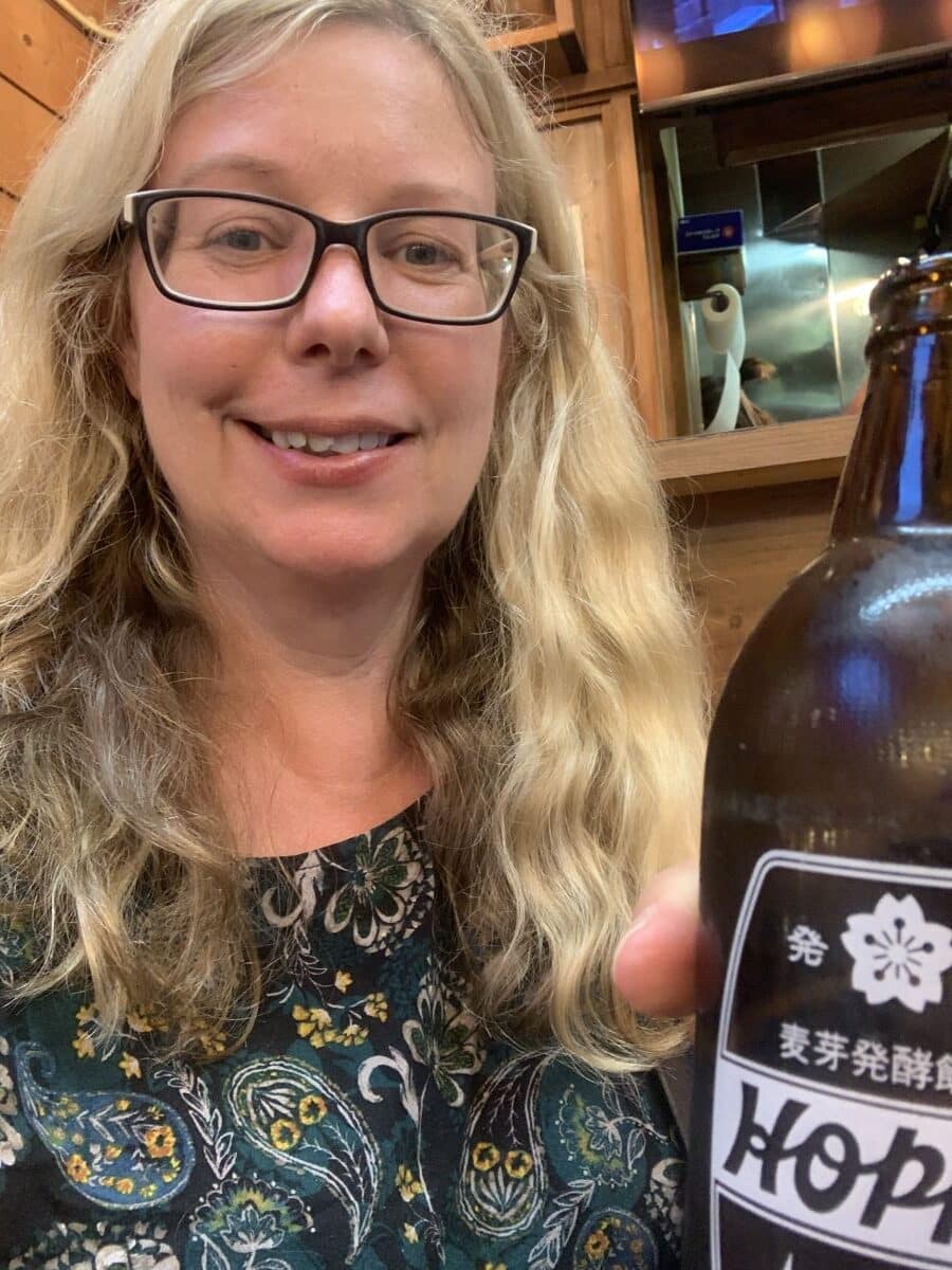 Helen from Japlanease holds a bottle of Hoppy in Asakusa