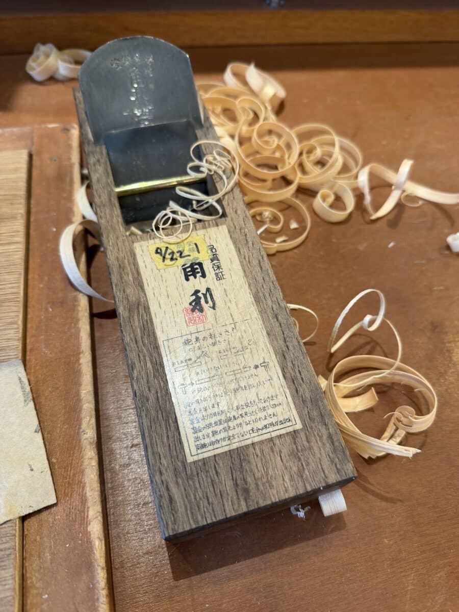 Top of the kana, the plane used to make chopsticks covered in wood shavings