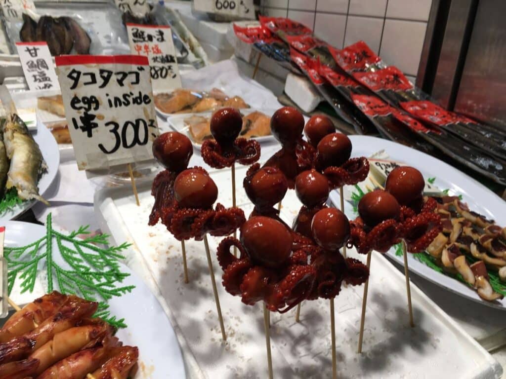 Rows of small octopus on sticks in Nishiki Market, Kyoto
