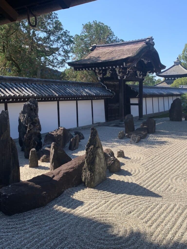 raked sand and rocks sit in one of Zen gardens in Tofukuji