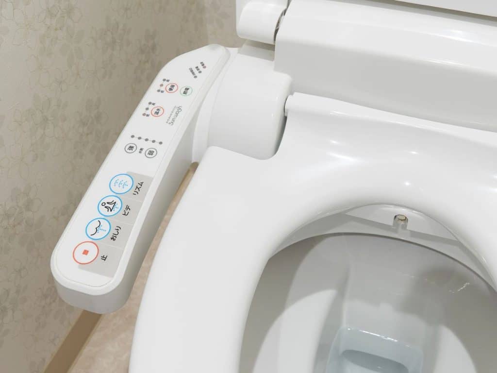 Japanese toilet showing different washing functions