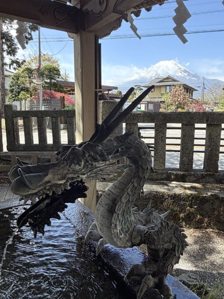 Traditional Japanese handwashing font with a dragon water spout - Mount Fuji is behind the dragon
